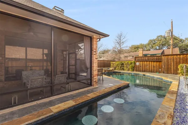 a view of a balcony with furniture