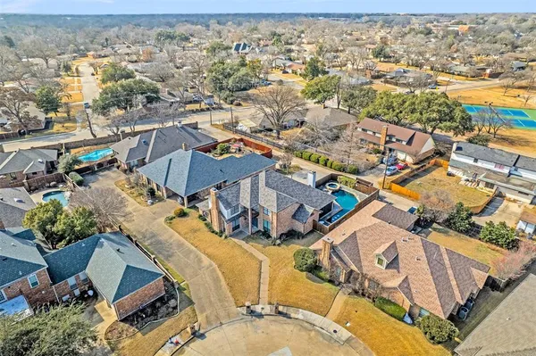 an aerial view of a house with a ocean view