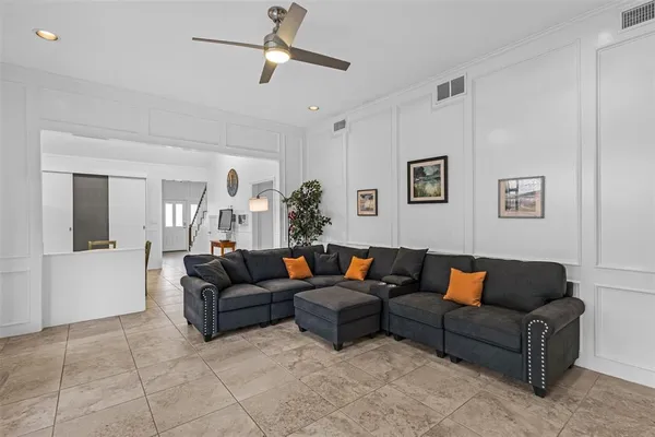 a living room with furniture and a couch