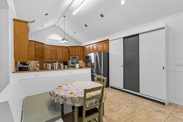 a dining room with furniture and window