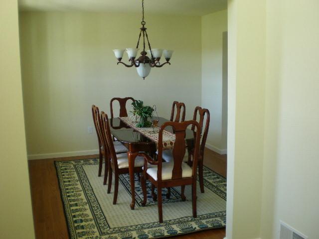 6002 Gilbert Road Gilbert, PA 18331 - Photo 5 of 22 a view of a dining room with furniture and a chandelier