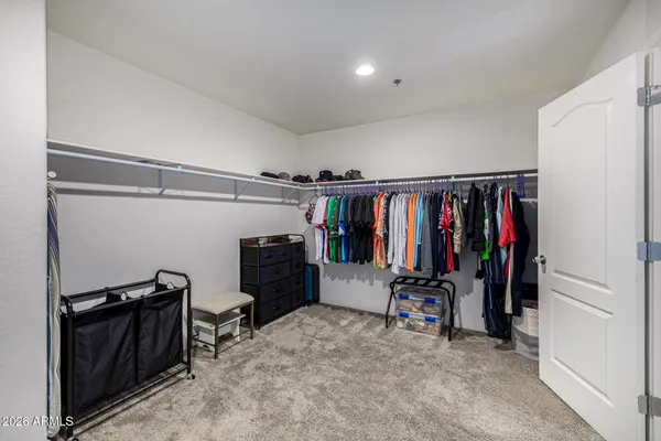 a bathroom with a tub a sink and glass door shower