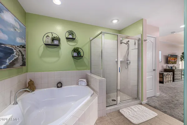 a lobby with furniture and a potted plant