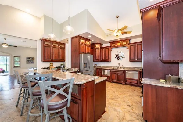 a view of a dining room kitchen and furniture