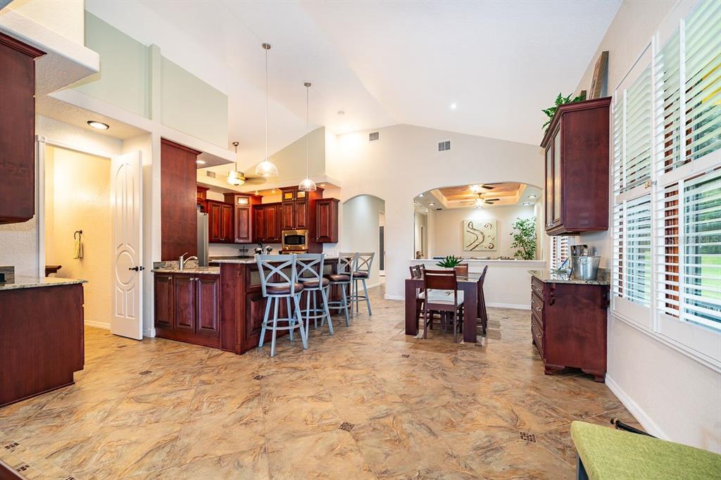 2339 Neptune Road, Unit A Kissimmee, FL 34744 - Photo 17 of 43 a room with lots of chairs and a view of living room