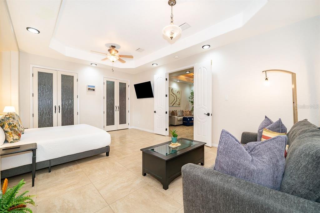 2339 Neptune Road, Unit A Kissimmee, FL 34744 - Photo 21 of 43 a living room with furniture and a chandelier