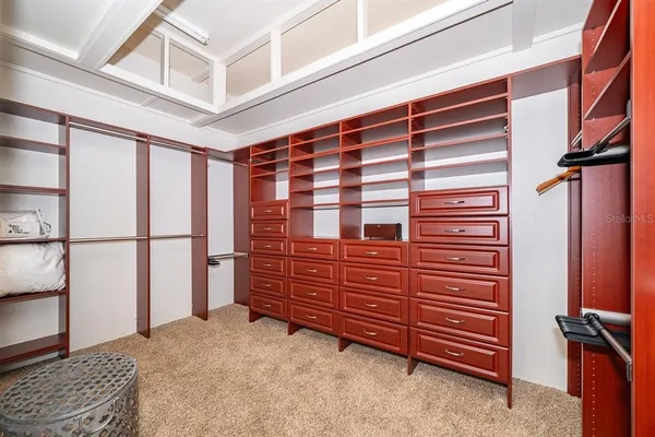 a view of bedroom with furniture and a window