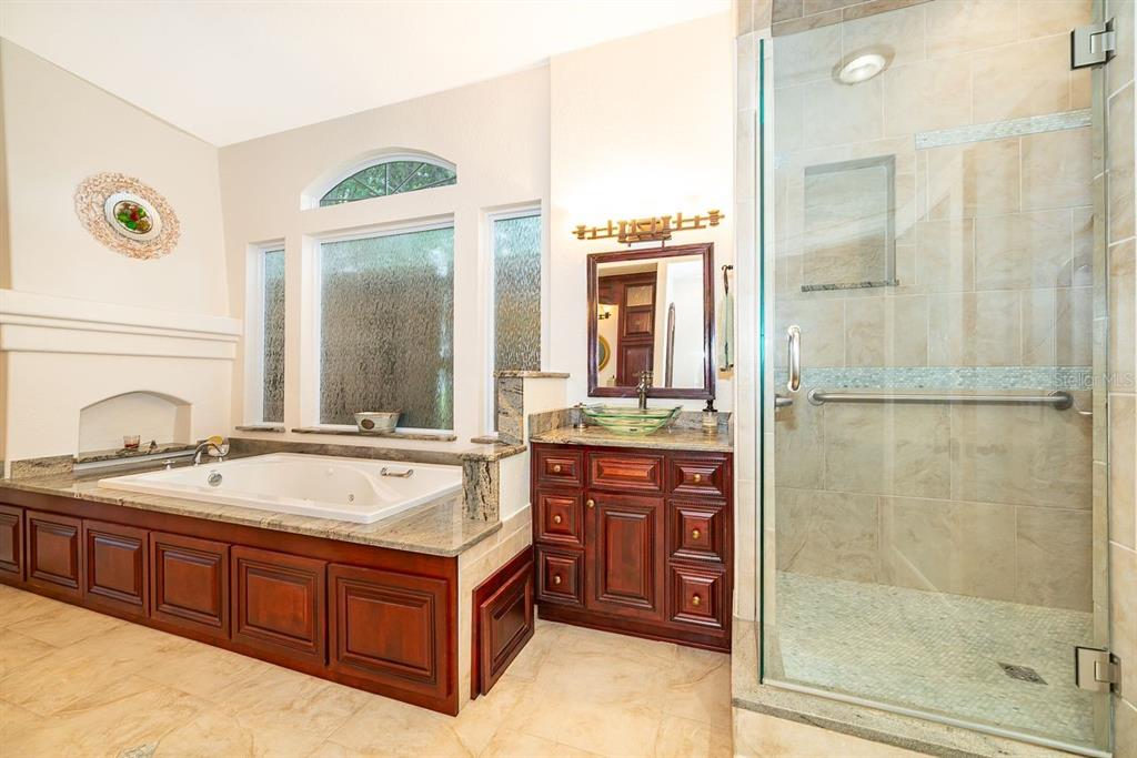 2339 Neptune Road, Unit A Kissimmee, FL 34744 - Photo 25 of 43 a spacious bathroom with a tub sink and mirror