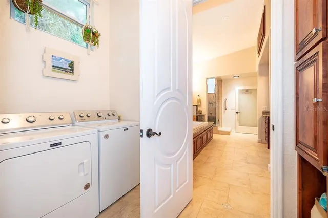 a spacious bathroom with a shower a sink and a mirror