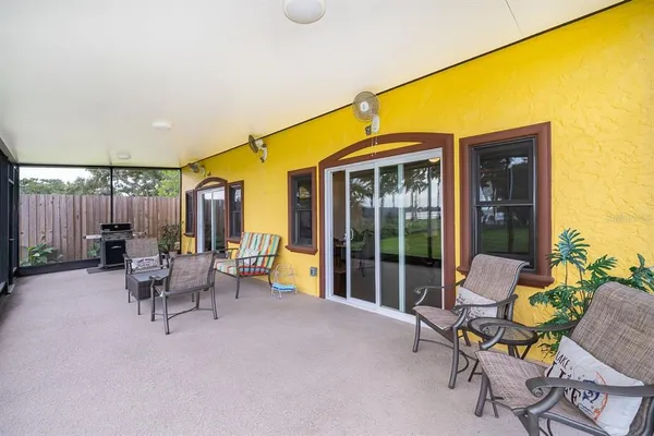 a balcony with chairs and a table
