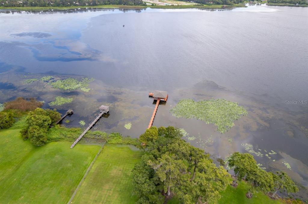 2339 Neptune Road, Unit A Kissimmee, FL 34744 - Photo 42 of 43 a backyard of a house with a yard and outdoor seating
