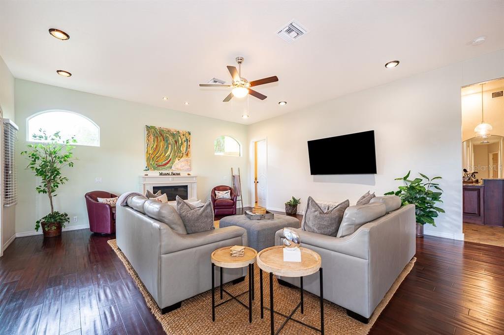 2339 Neptune Road, Unit A Kissimmee, FL 34744 - Photo 6 of 43 a living room with furniture and a flat screen tv