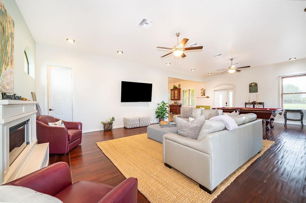 2339 Neptune Road, Unit A Kissimmee, FL 34744 - Photo 7 of 43 a living room with furniture fireplace and a flat screen tv