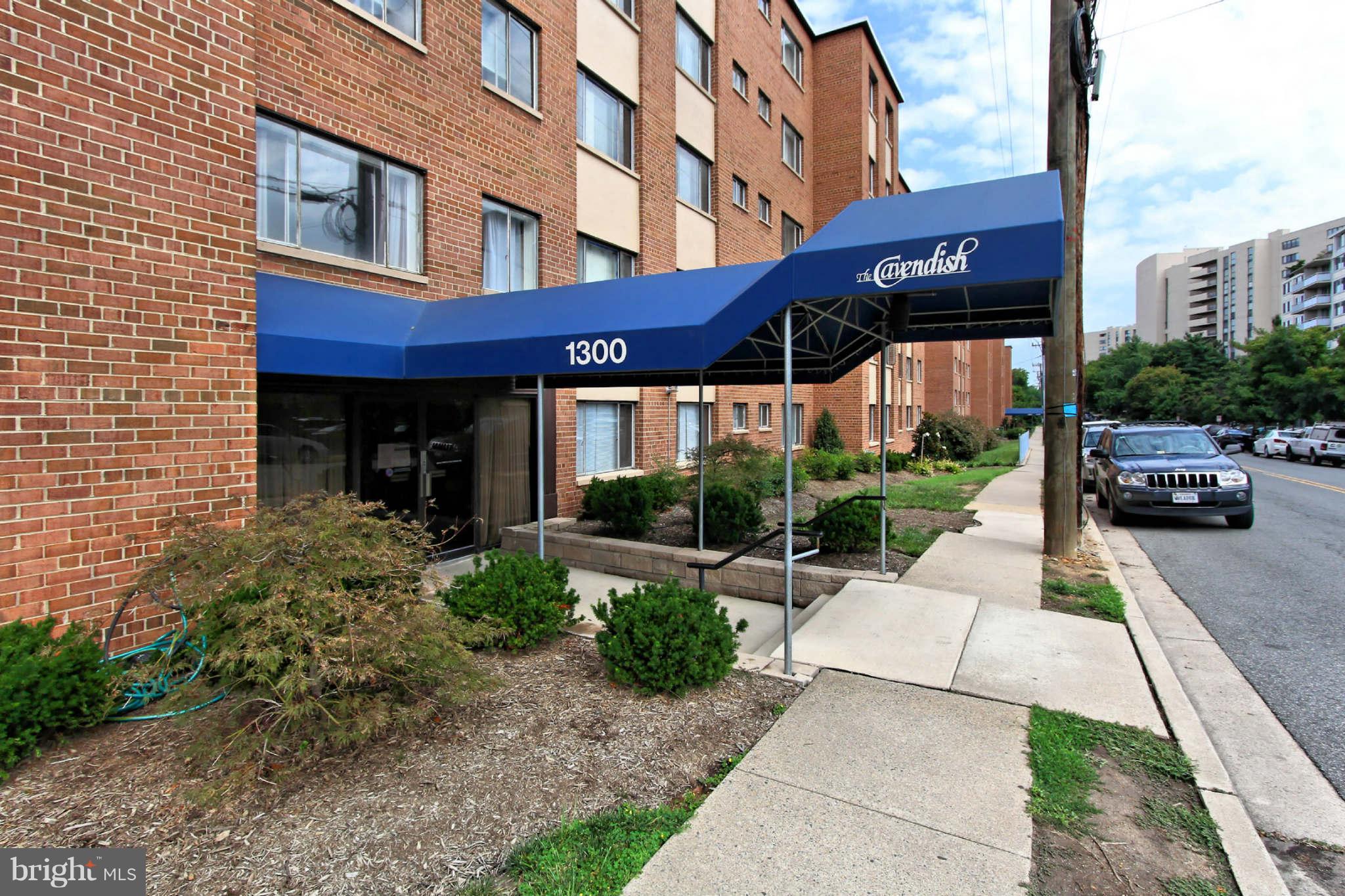 1300 South Arlington Ridge Road, Unit 201 Arlington, VA 22202 - Photo 1 of 29 a view of a building with a patio