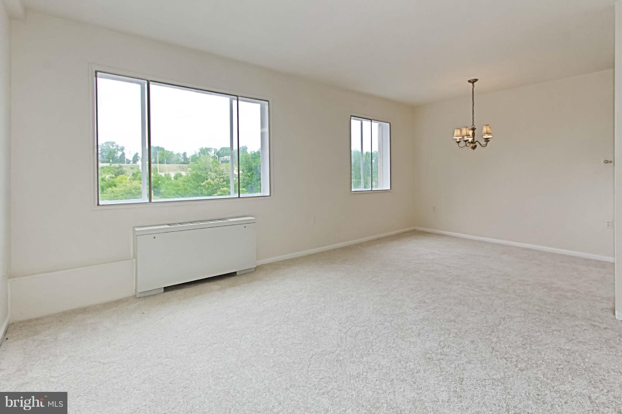 1300 South Arlington Ridge Road, Unit 201 Arlington, VA 22202 - Photo 22 of 29 an empty room with windows
