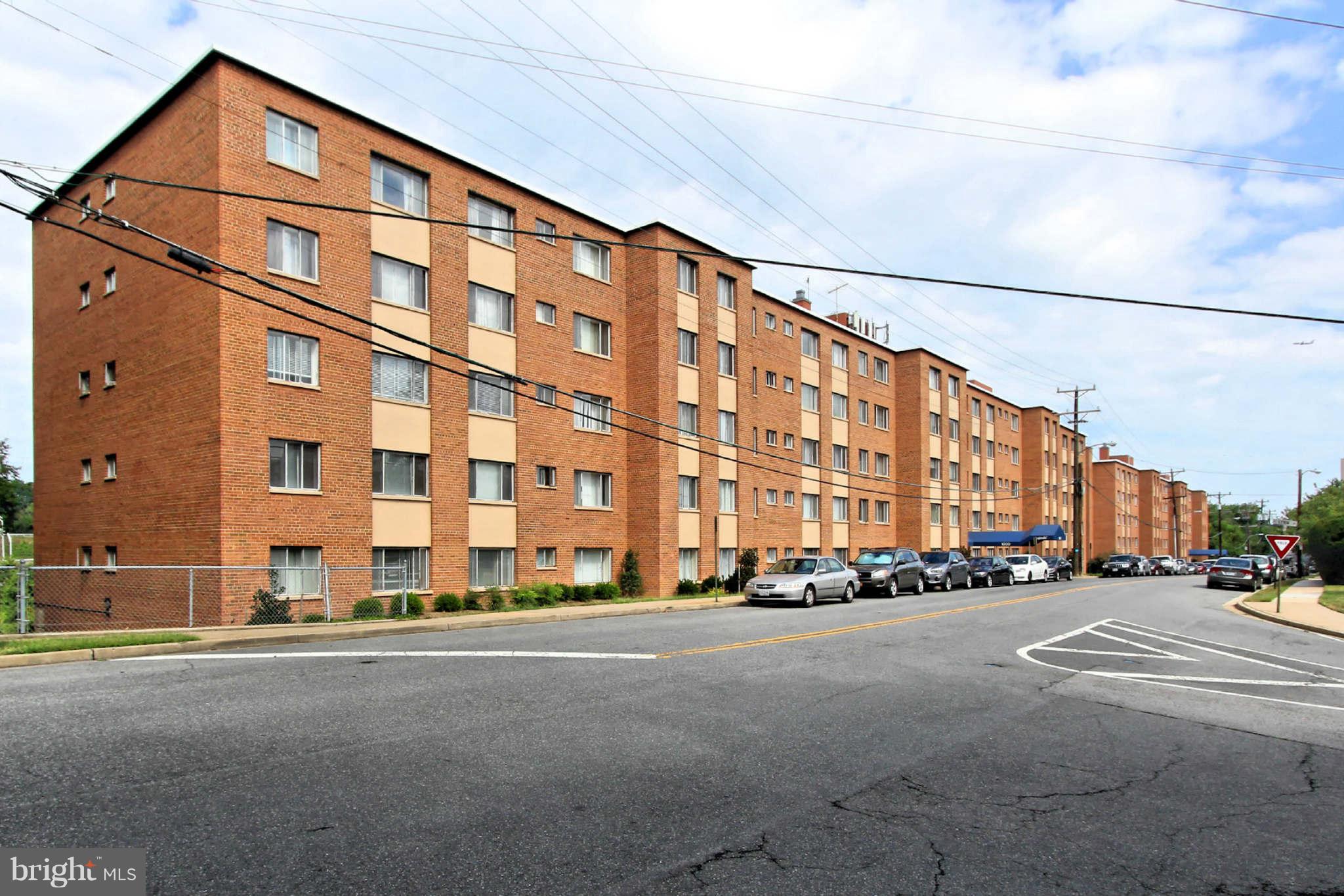 1300 South Arlington Ridge Road, Unit 201 Arlington, VA 22202 - Photo 4 of 29 a city street lined with buildings and a street sign