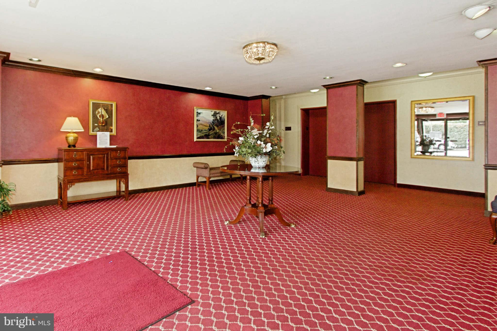 1300 South Arlington Ridge Road, Unit 201 Arlington, VA 22202 - Photo 6 of 29 a living room with furniture a rug and a flat screen tv
