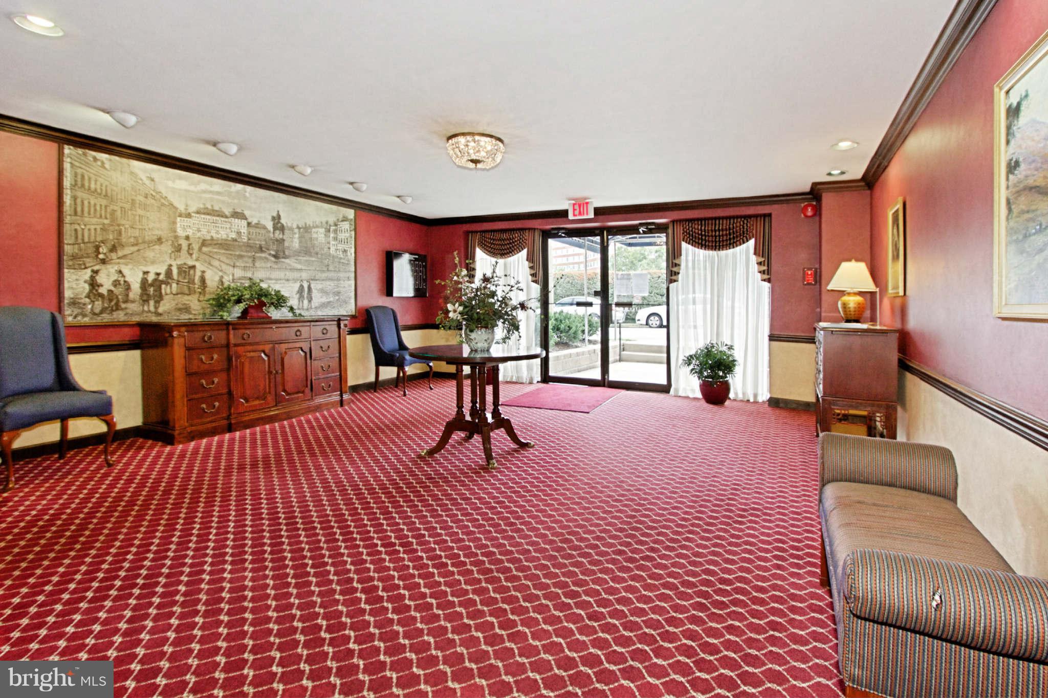 1300 South Arlington Ridge Road, Unit 201 Arlington, VA 22202 - Photo 7 of 29 a living room with furniture large windows and wooden floor
