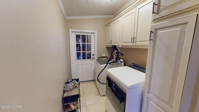 a bedroom with two beds and a dresser