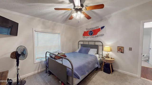 a bedroom with furniture and a chandelier