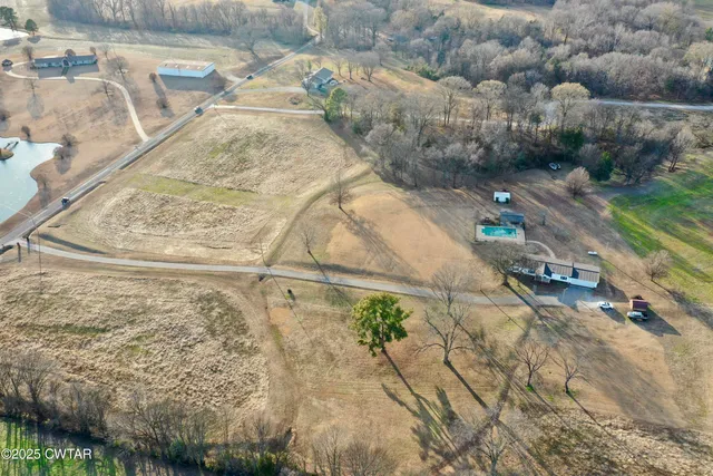 swimming pool view with plants and lake view
