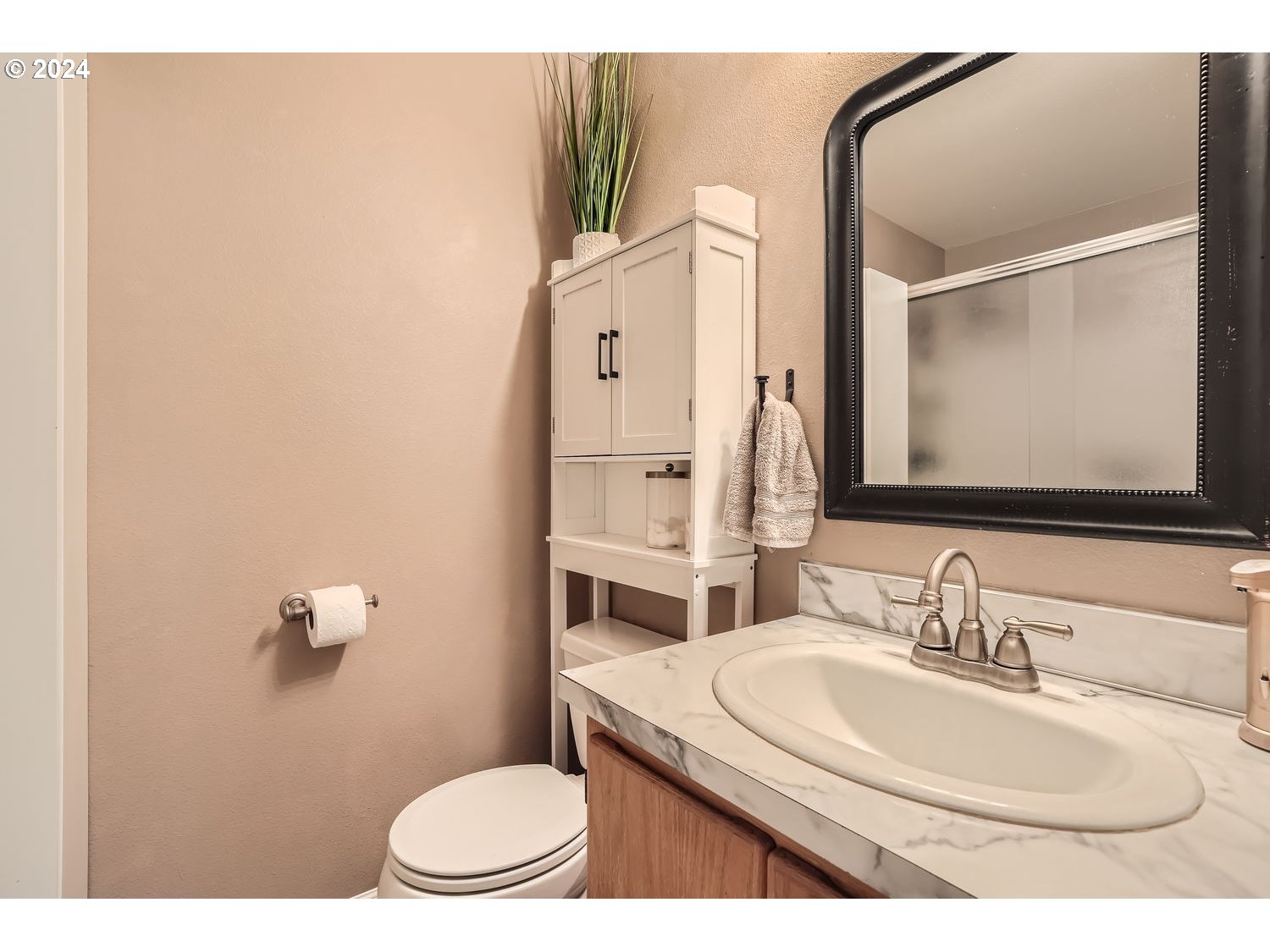 19504 Southeast 41st Circle Camas, WA 98607 - Photo 20 of 27 a bathroom with a sink toilet and mirror
