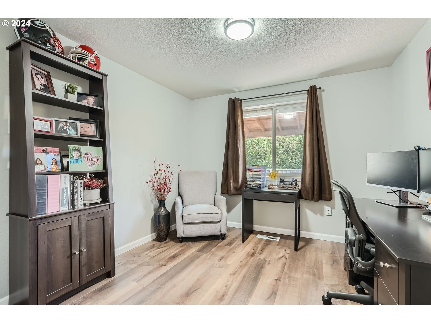 19504 Southeast 41st Circle Camas, WA 98607 - Photo 23 of 27 a living room with furniture and a flat screen tv