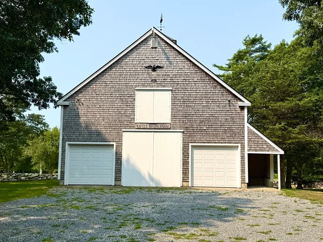 a view of a house with a yard and garage
