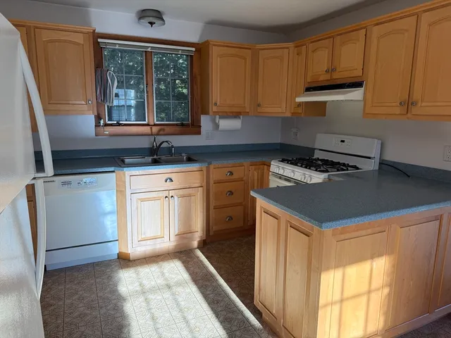 a view of a room with window wooden floor and windows