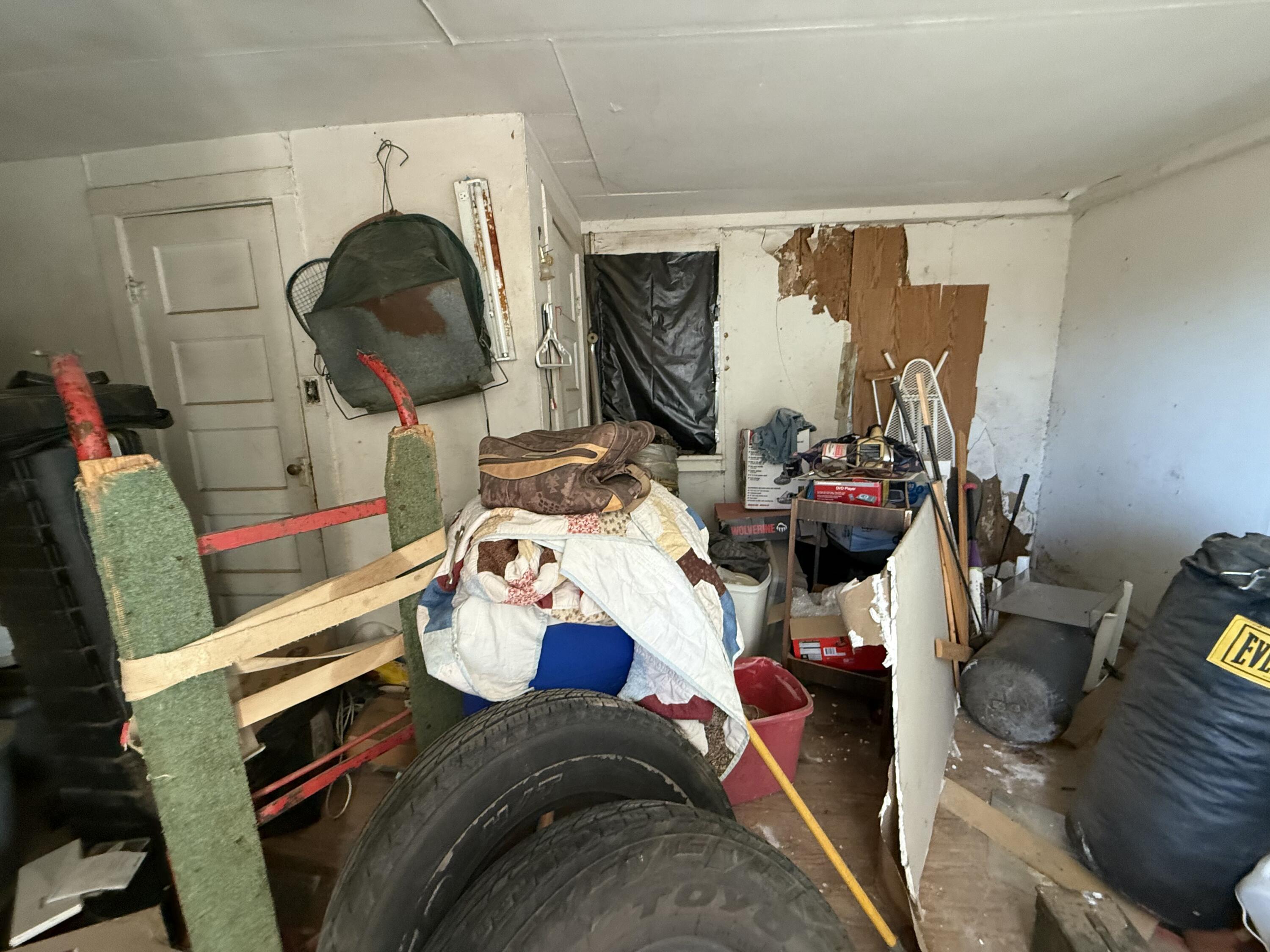 1924 14th Street Lubbock, TX 79401 - Photo 12 of 39 a bedroom with a bed and a mirror