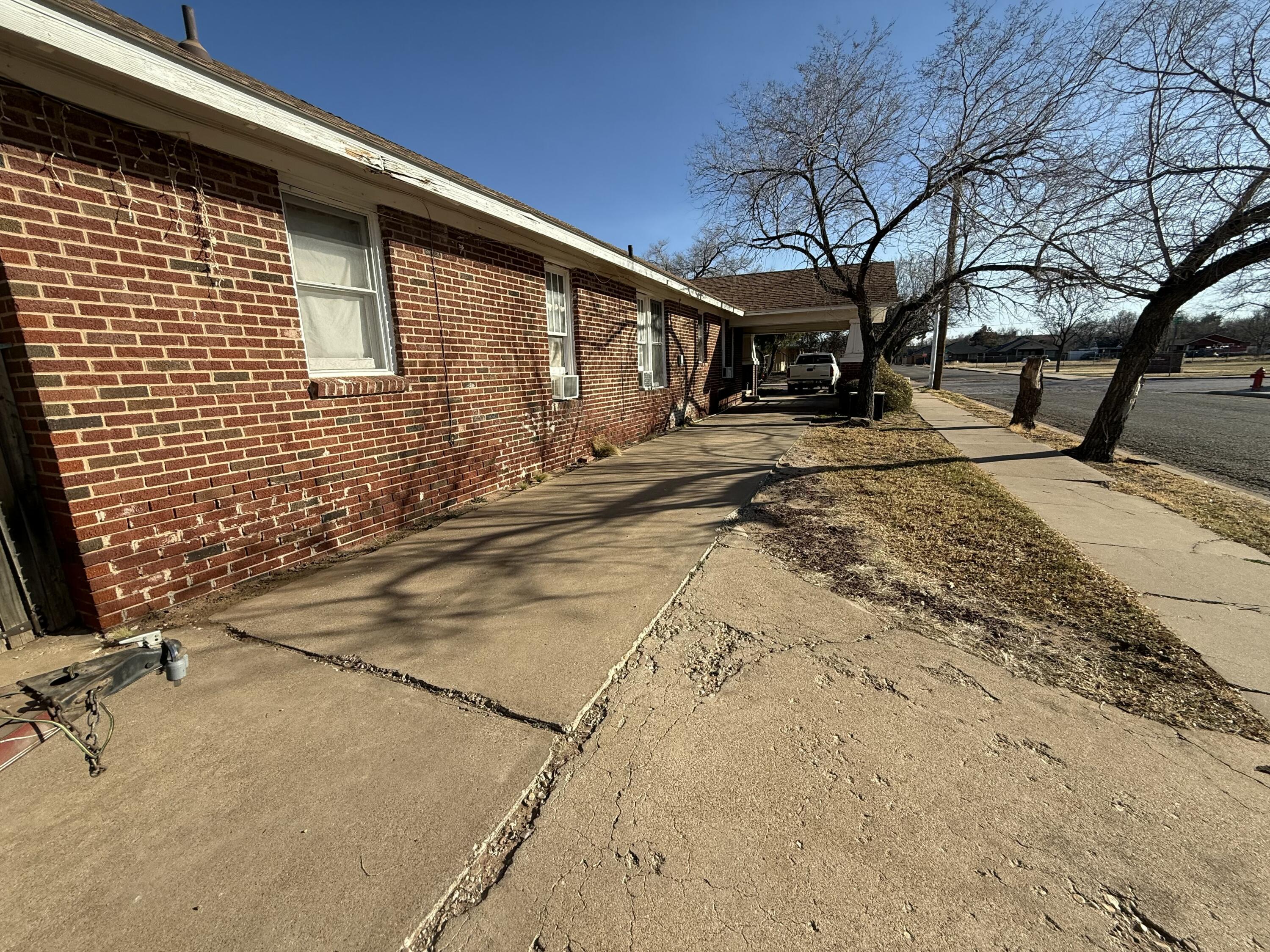 1924 14th Street Lubbock, TX 79401 - Photo 16 of 39 a view of a house with snow on the road