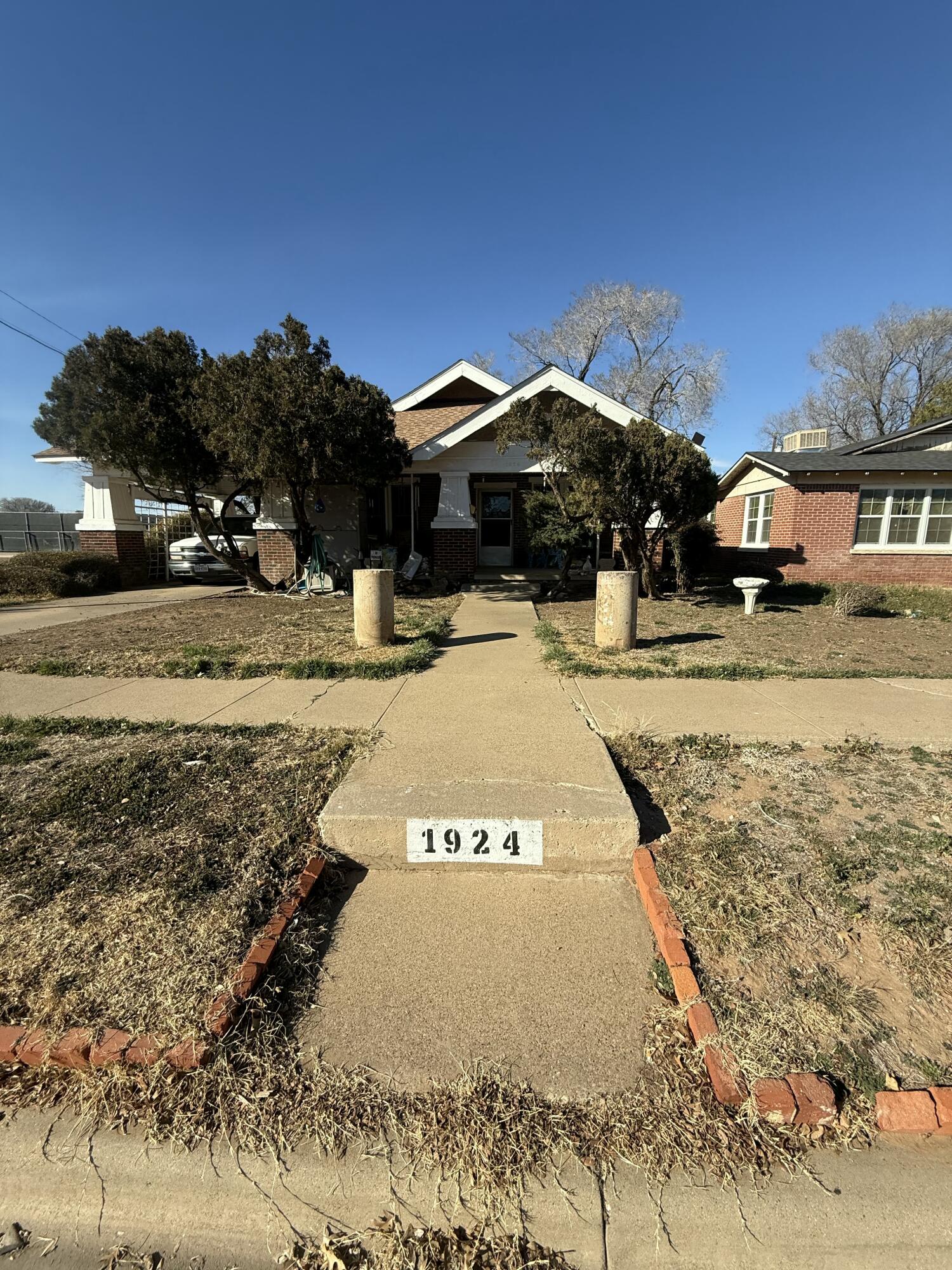 1924 14th Street Lubbock, TX 79401 - Photo 2 of 39 a view of a yard with a tree