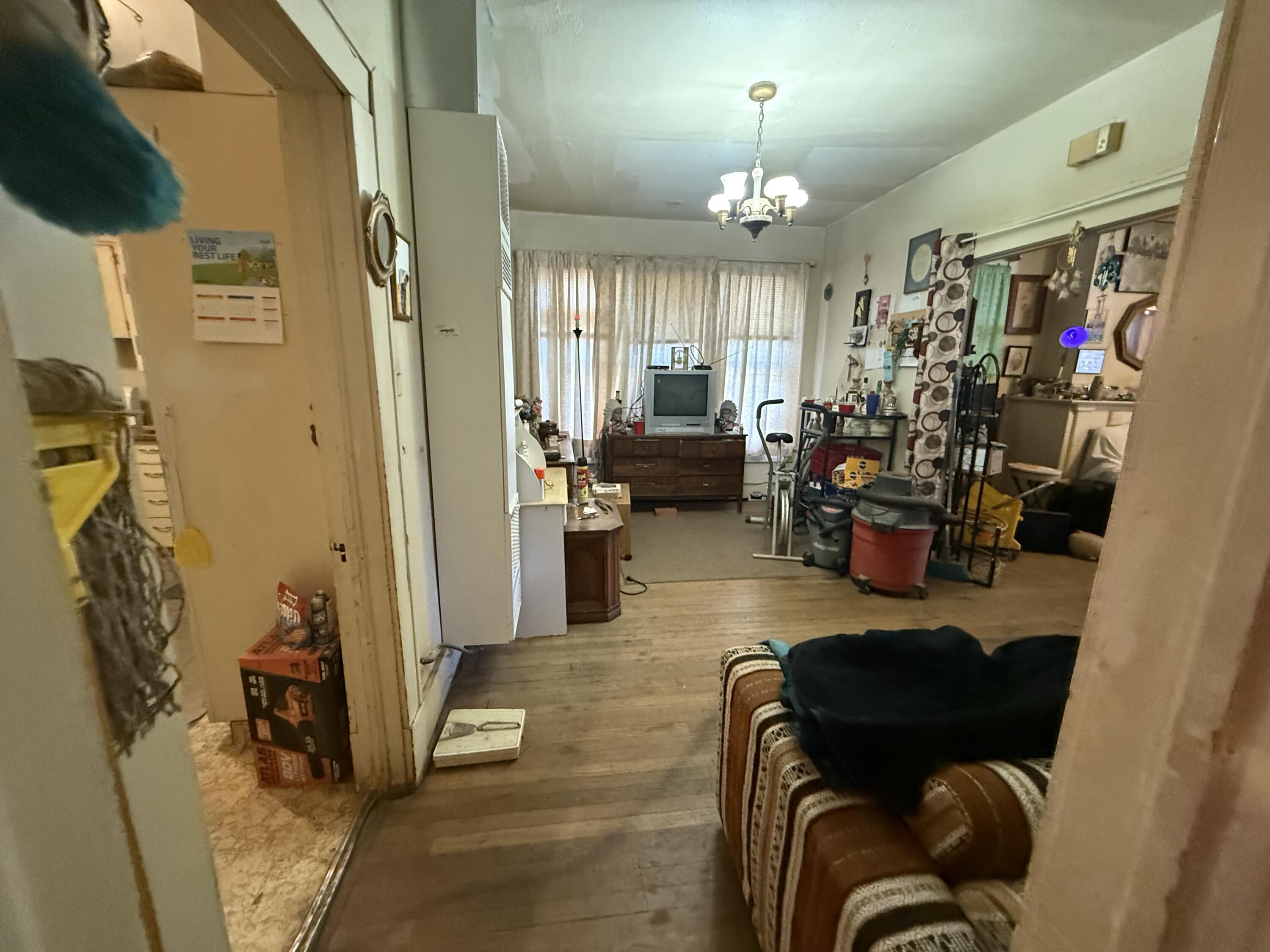 1924 14th Street Lubbock, TX 79401 - Photo 22 of 39 a living room with furniture and a chandelier