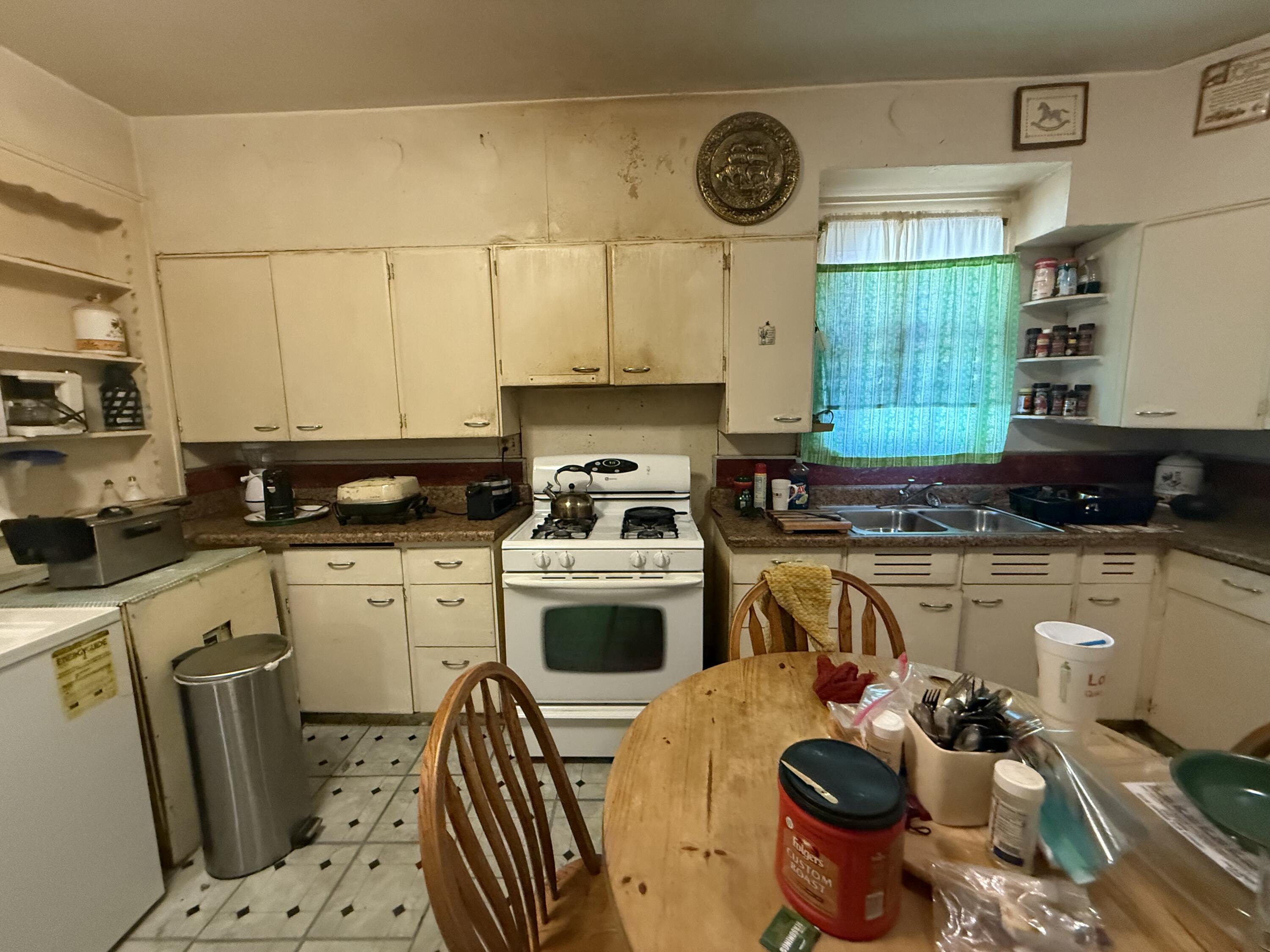 1924 14th Street Lubbock, TX 79401 - Photo 33 of 39 a kitchen with a sink cabinets and appliances
