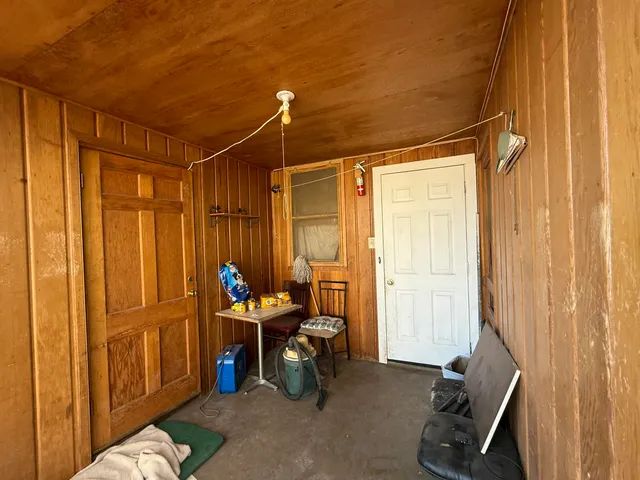 a living room filled with furniture and a window