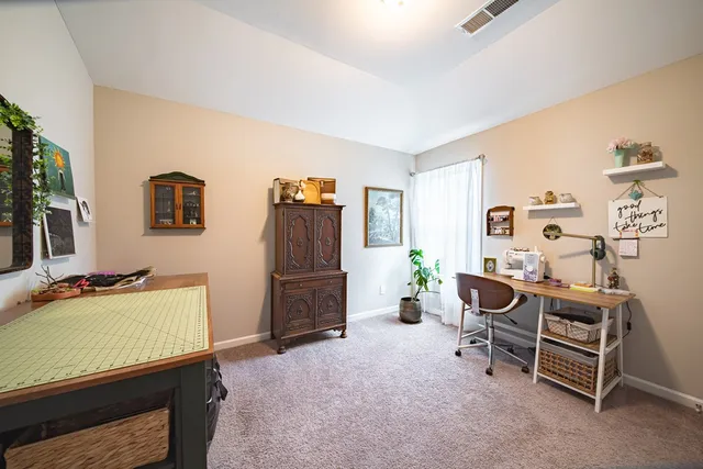 a bedroom with furniture and a bed