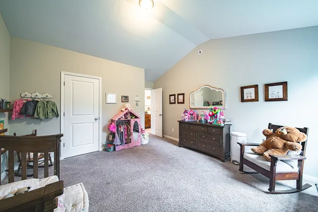 a bed room with furniture and toys