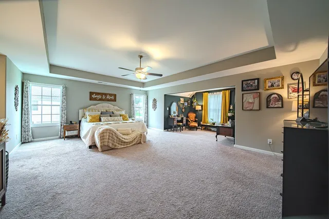 a bedroom with a bed and lamp