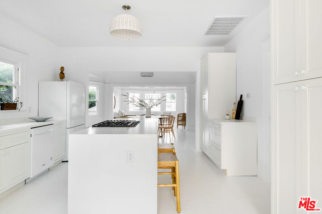 1163 Nelrose Avenue Venice, CA 90291 - Photo 13 of 32 a kitchen with a stove a refrigerator and a sink