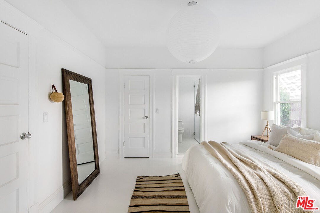 1163 Nelrose Avenue Venice, CA 90291 - Photo 19 of 32 a bedroom with a bed and a window