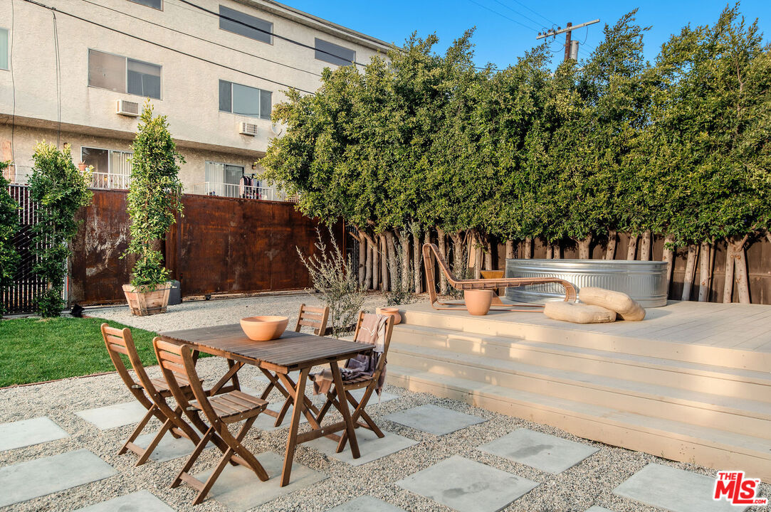 1163 Nelrose Avenue Venice, CA 90291 - Photo 28 of 32 a view of a patio with table and chairs and potted plants