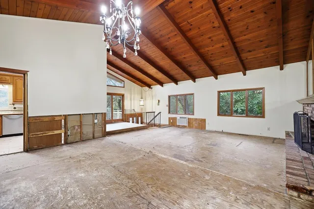 an aerial view of a house with a yard basket ball court and outdoor seating