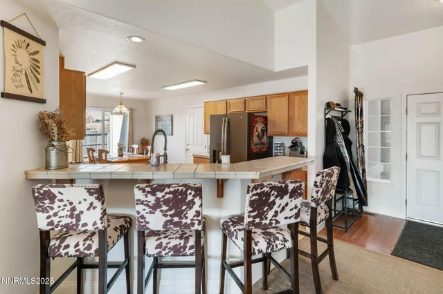 a kitchen with a table and chairs in it