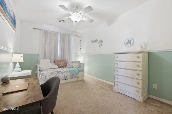 a view of a house with swimming pool and sitting area