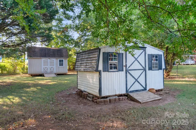 a view of a backyard with a barn