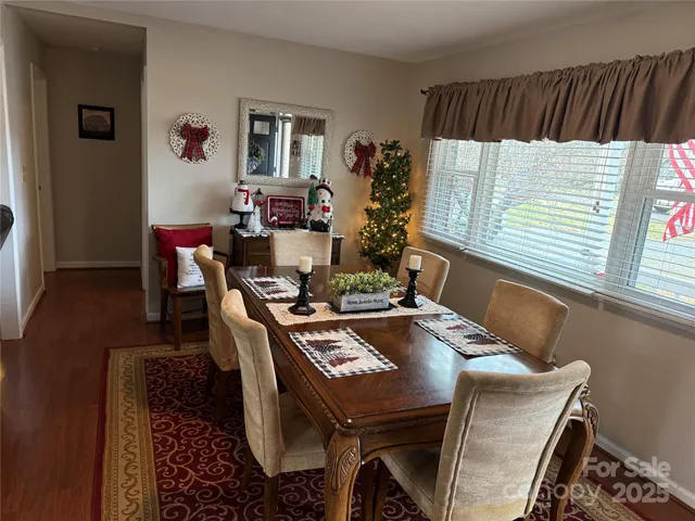 a view of a dining room with furniture and window