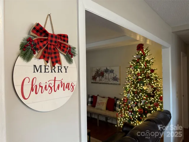 a sign that is on the wall and a potted plant