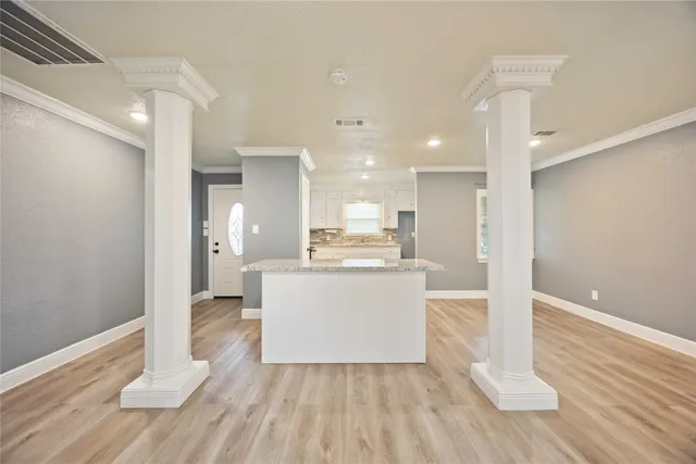 a view of kitchen with wooden floor