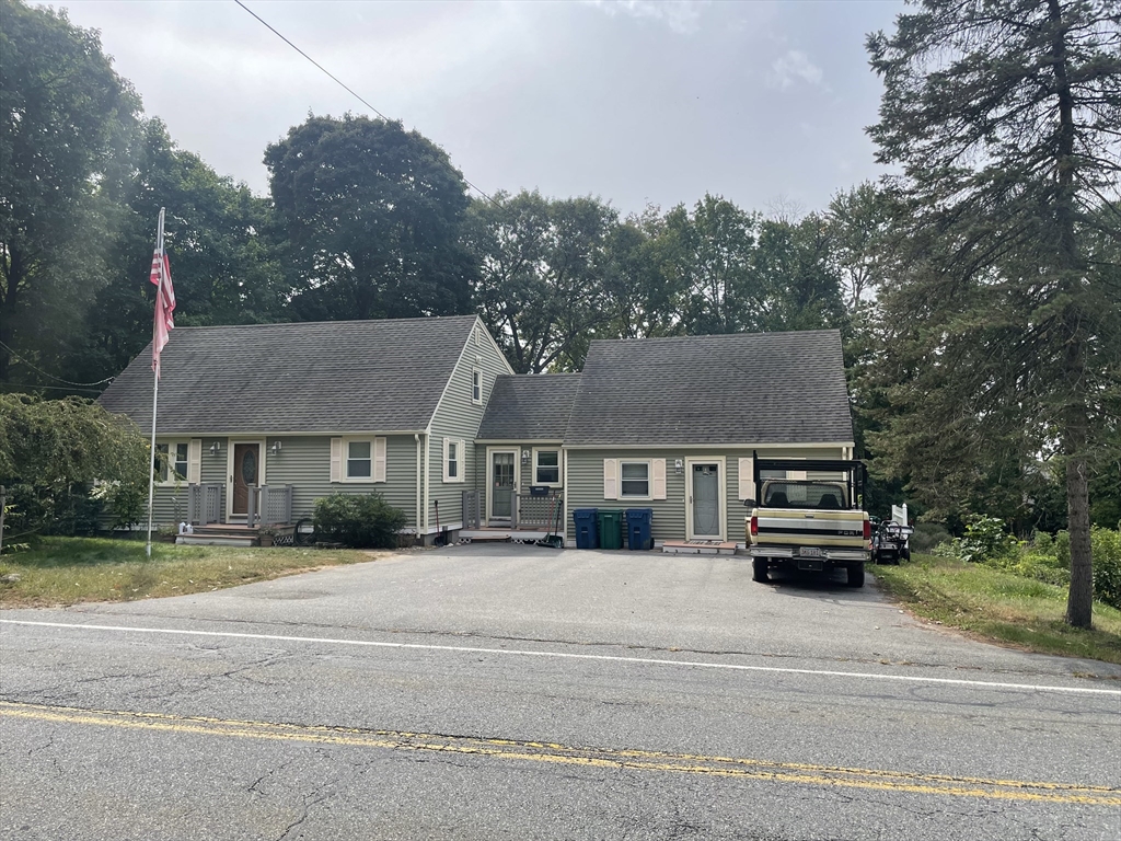 75 Lexington Road Billerica, MA 01821 - Photo 1 of 25 a front view of a house with a garden