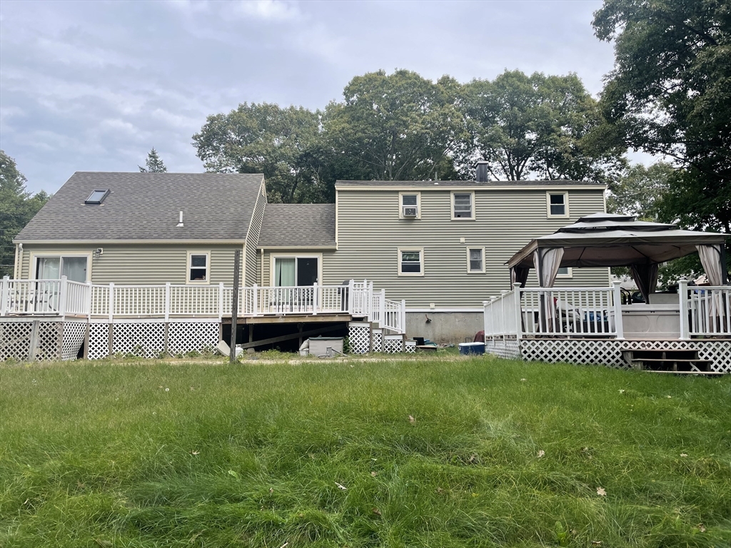 75 Lexington Road Billerica, MA 01821 - Photo 23 of 25 a front view of a house with a garden and deck